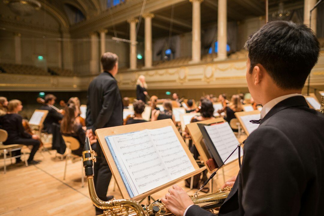 Orchestra performing on stage in a German concert hall